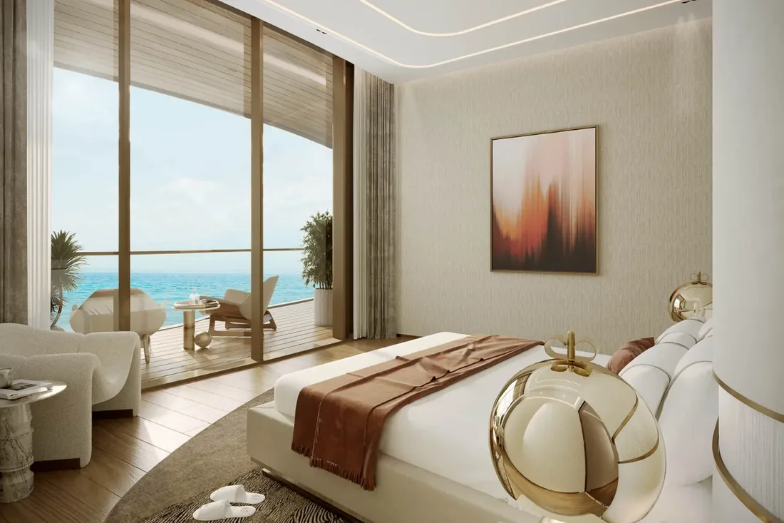 Master bedroom interior opening to a terrace with sea views