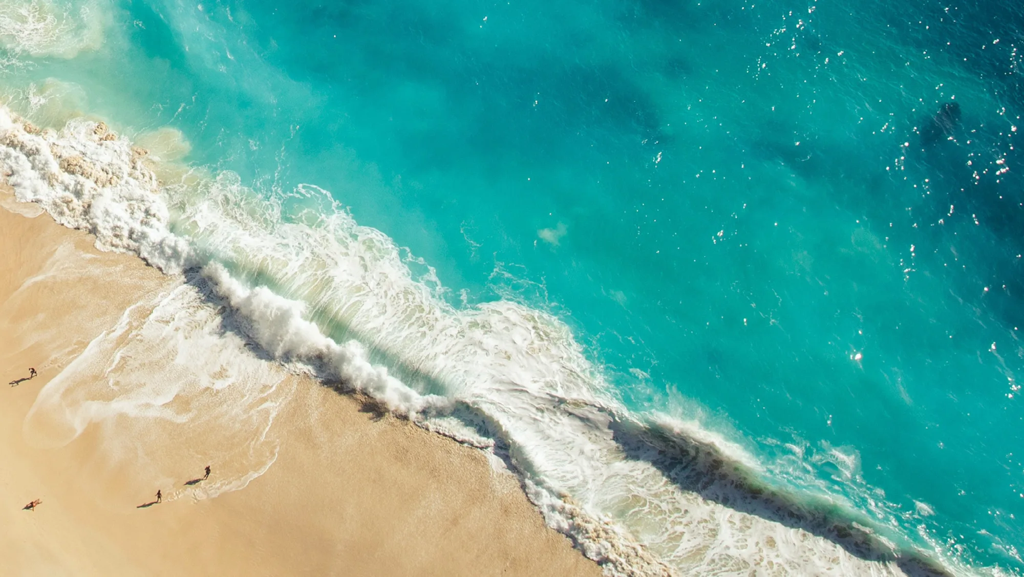 Aerial view of the azure Persian Gulf waters beside The Pearl Qatar beachfront