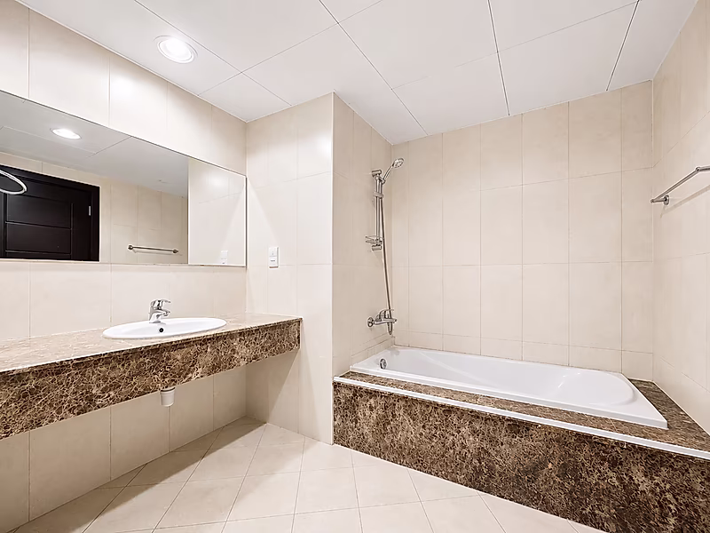 Spacious 1-Bedroom in Premium Tower | Balcony & Luxury Living - Photo 7