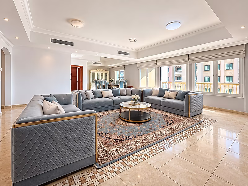 Luxury Living in Porto Arabia | 3BR with Balcony Views - Photo 1