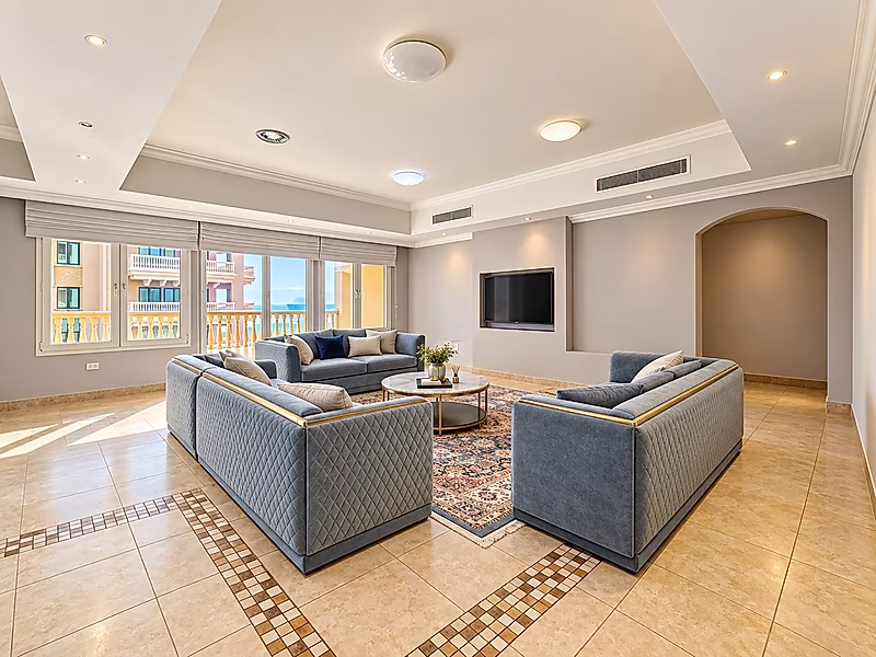 Luxury Living in Porto Arabia | 3BR with Balcony Views - Photo 2