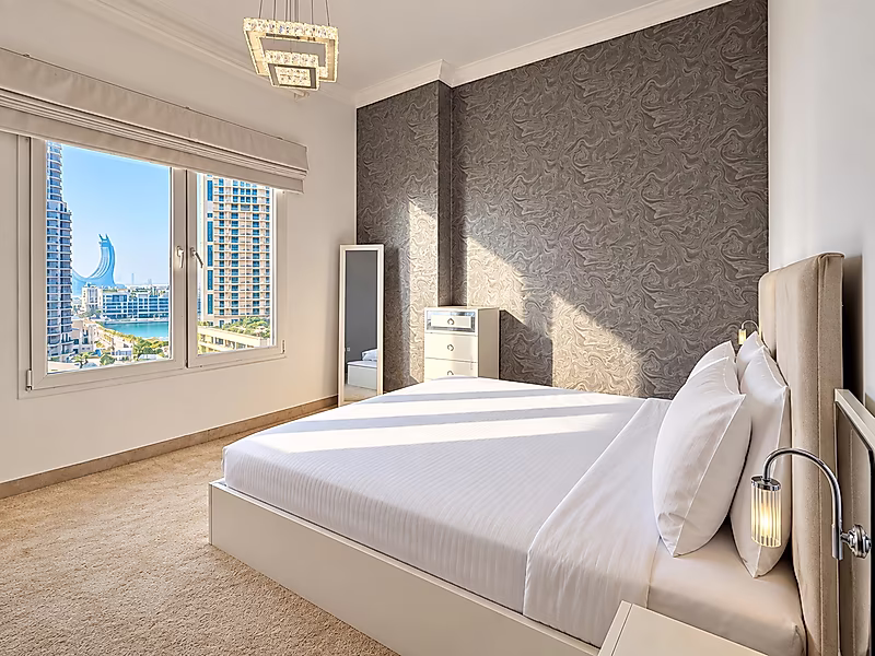 Luxury Living in Porto Arabia | 3BR with Balcony Views - Photo 5