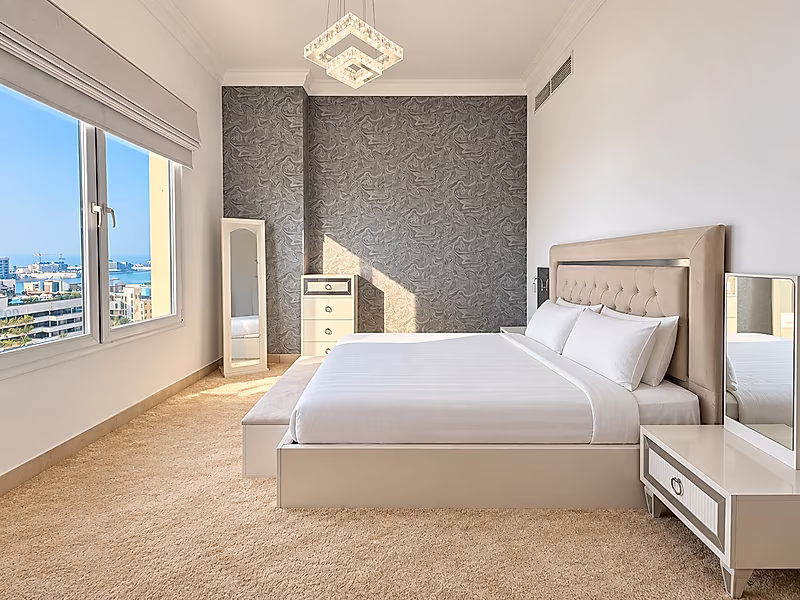 Luxury Living in Porto Arabia | 3BR with Balcony Views - Photo 6