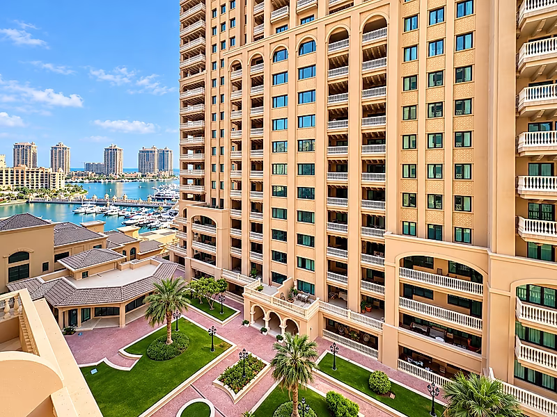 Luxury Living in Porto Arabia | 3BR with Balcony Views - Photo 9
